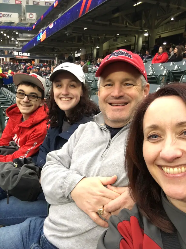 four people at a baseball practicing gratitude