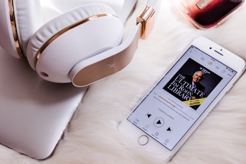 Audio book and headphones make reading easier for moms with migraine.
