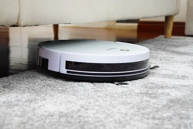 roomba vacuuming the carpet