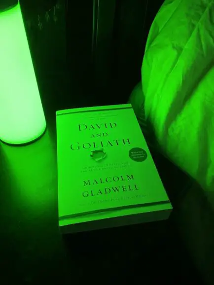 closed book with Allay Lamp for green light for migraine