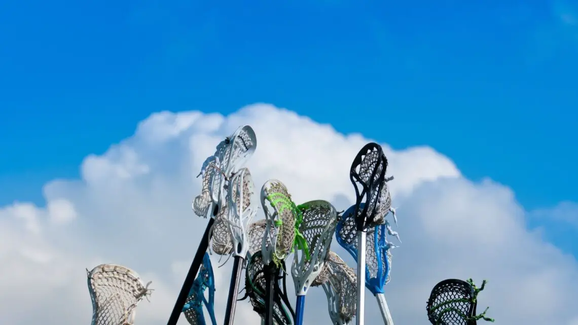 Migraine and sports Lacrosse sticks held high