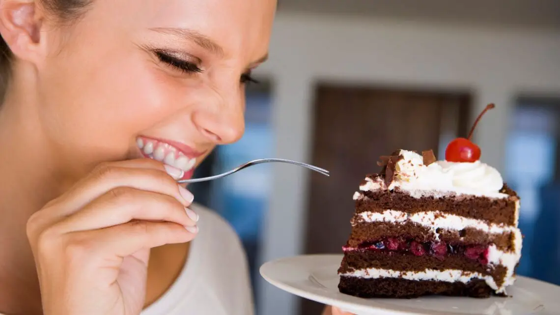 pic of woman eating cake