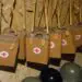 brown bags with red cross on them used for at home migraine treatment plan